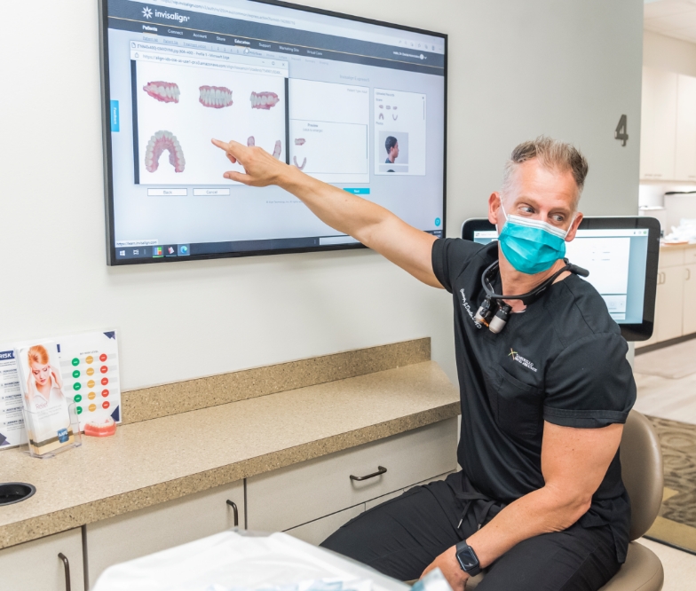 Dentist pointing to digital bite impressions