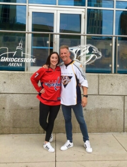 Doctor Devlin and his wife in hockey jersey