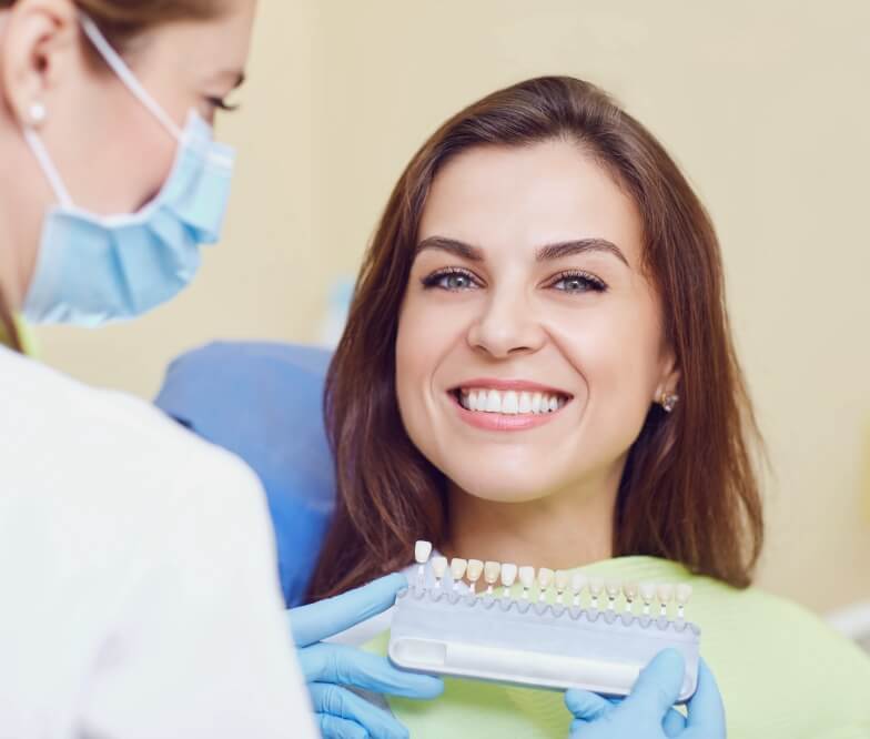 Dental patient smiling during restorative dentistry visit