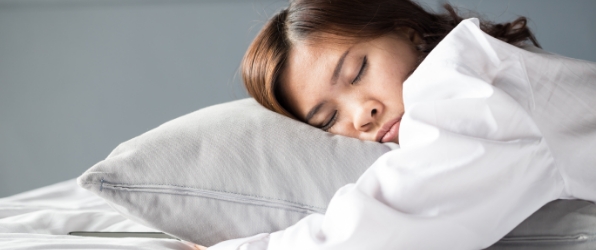 Woman sleeping soundly thanks to sleep apnea therapy