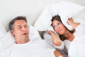 woman angry with husband about snoring
