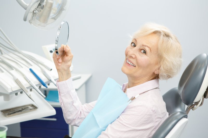 Elderly woman with dental implants
