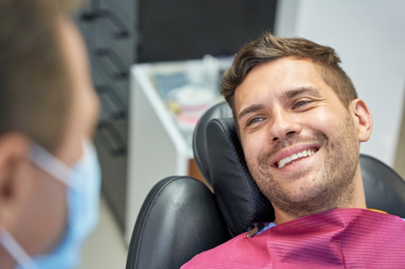 patient smiling at dentist in Houston