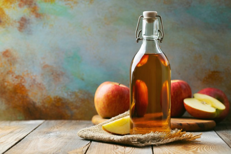apple cider vinegar bottle on table