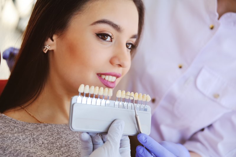 patient getting veneers from dentist in Houston