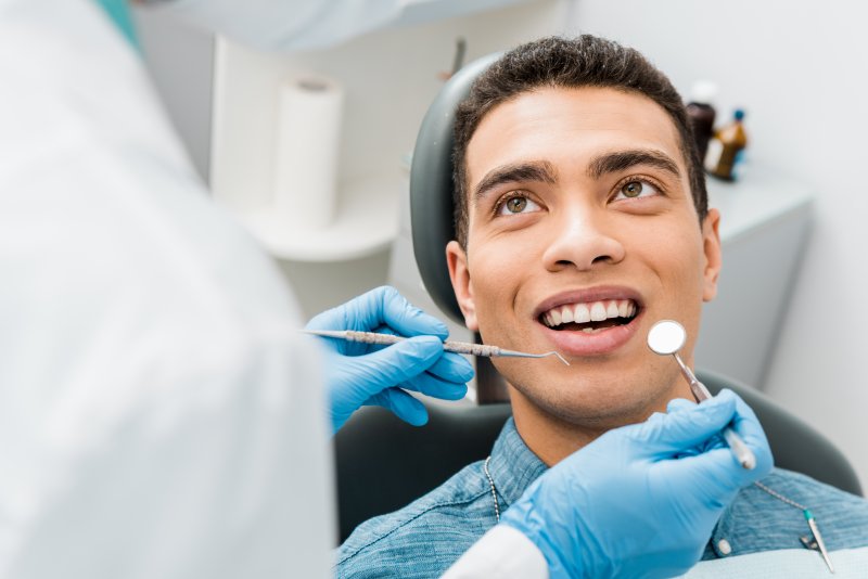 young man visiting dentist in Houston