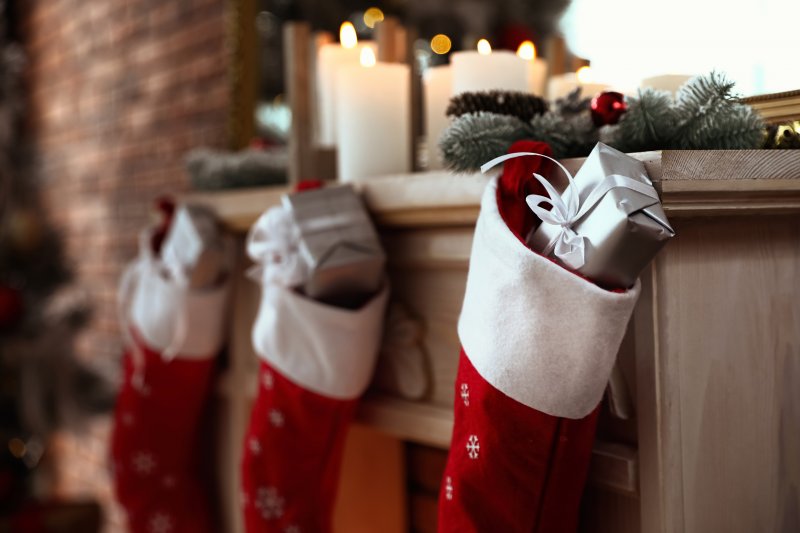 stocking stuffers hanging on fireplace