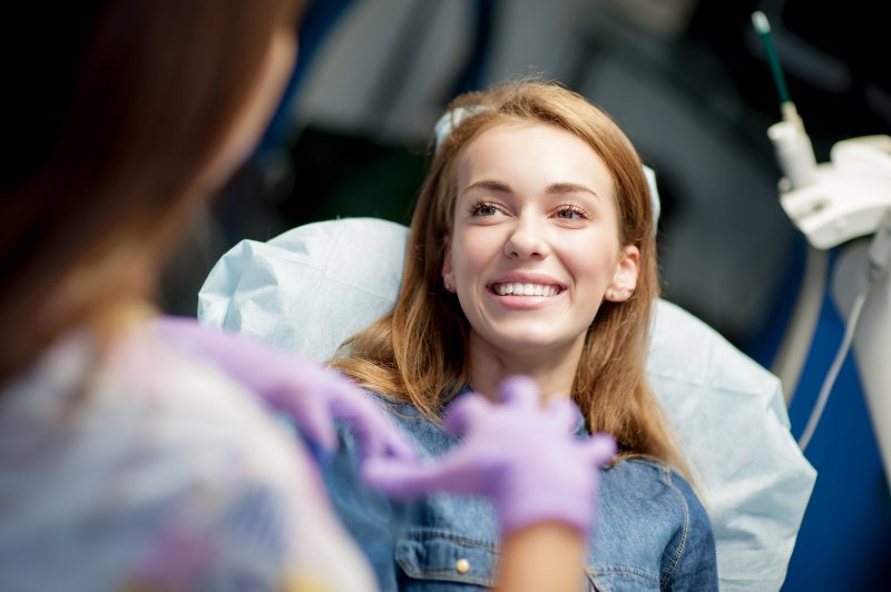 young patient smiling while visiting dentist 